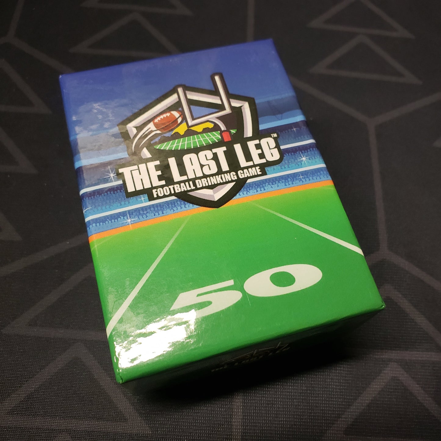 Image shows the front cover of the box for the The Last Leg: Football Drinking Game card game