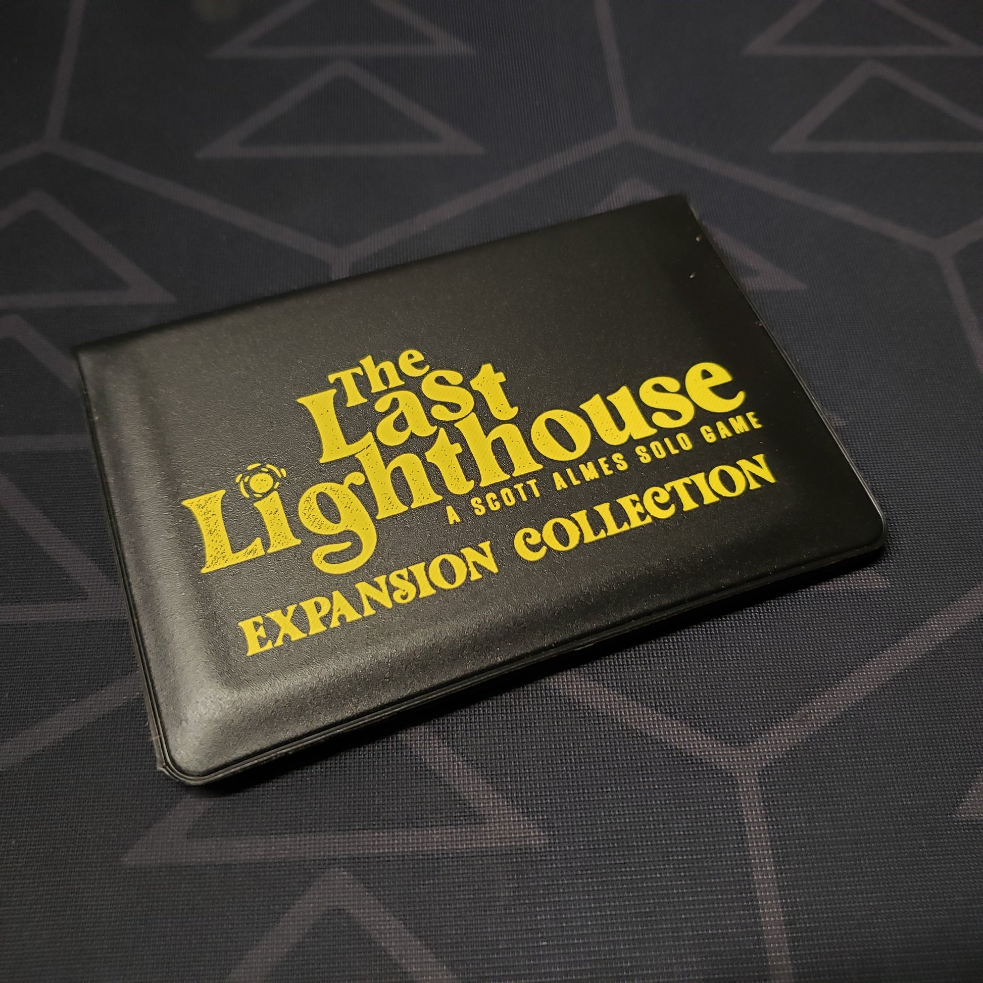 Image shows the front of the card wallet of the Expansion Collection for the card game The Last Lighthouse