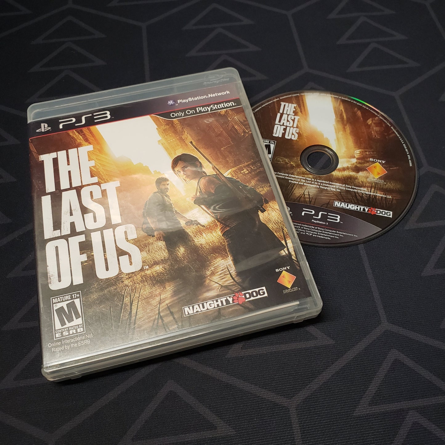 Image shows the case and disc for the video game The Last of Us for Playstation 3