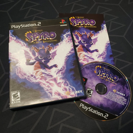 Image shows the case, manual and disc for the video game The Legend of Spyro: A New Beginning for Playstation 2
