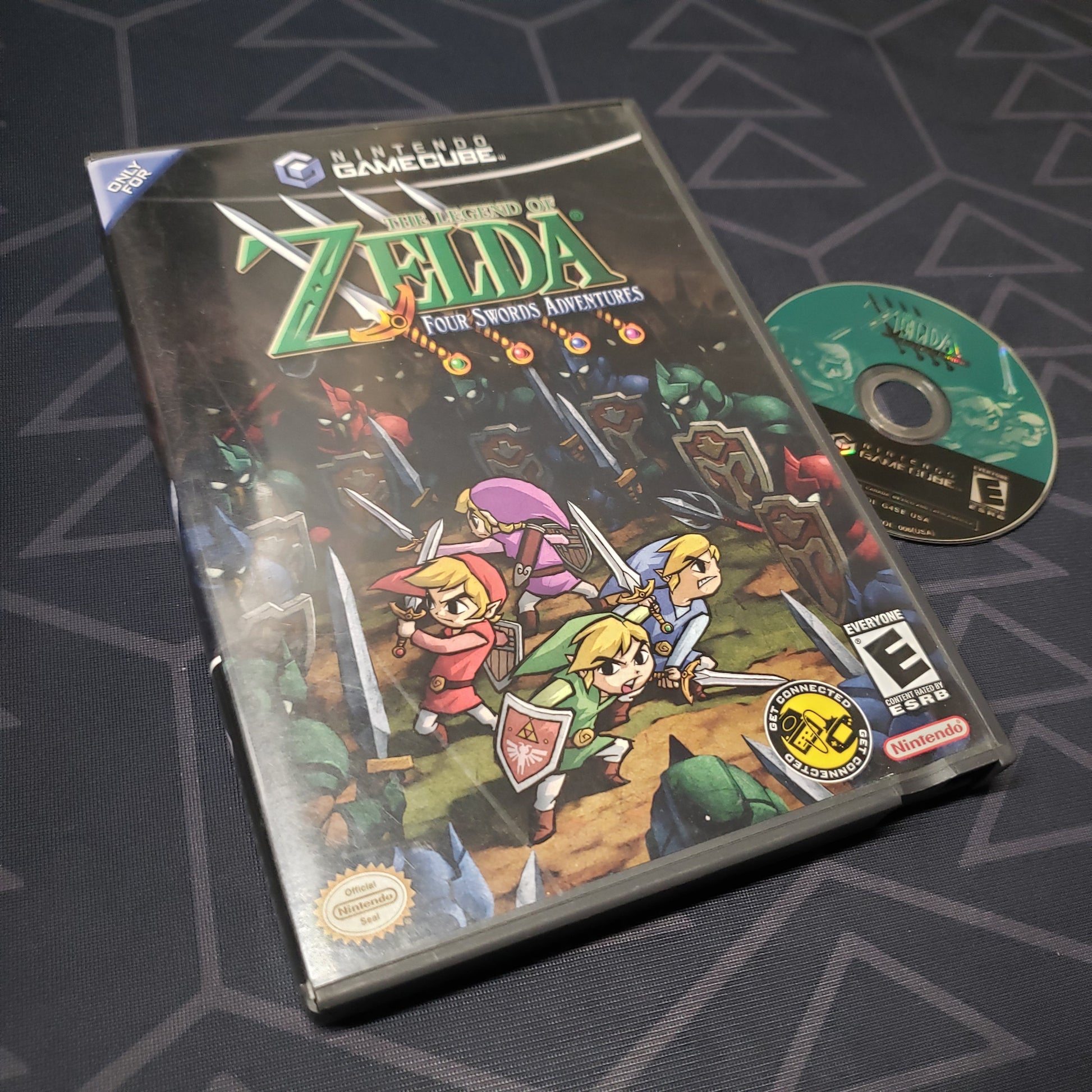 Image shows the case and disc for the video game The Legend of Zelda: Four Swords Adventures for Nintendo GameCube