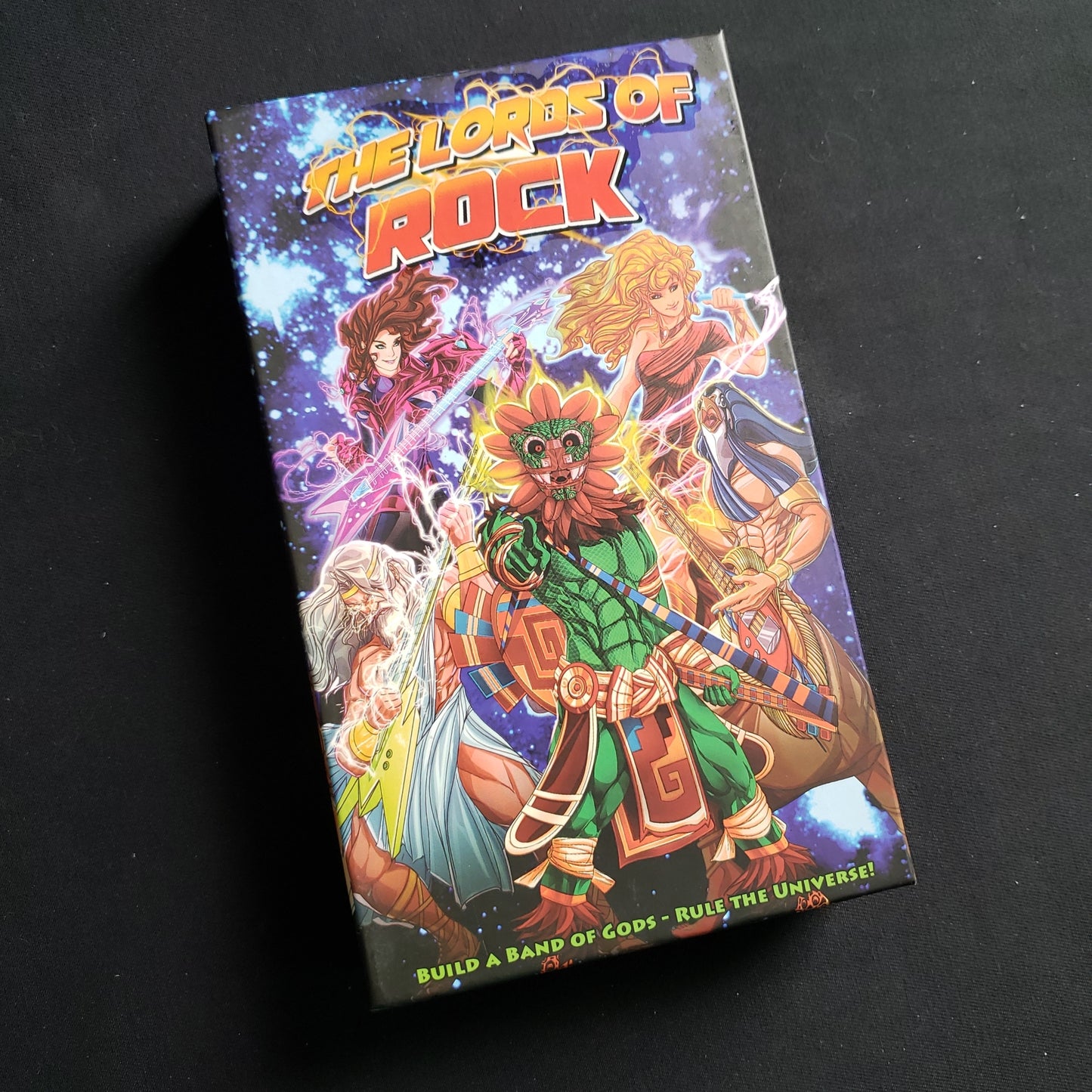 Image shows the front cover of the box of the Lords of Rock card game