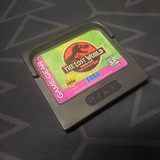 Image shows the front of the cartridge for the video game The Lost World: Jurassic Park for the Sega Game Gear