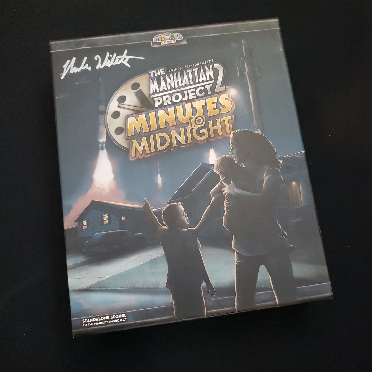 Image shows the front cover of the box of the Manhattan Project 2: Minutes to Midnight board game