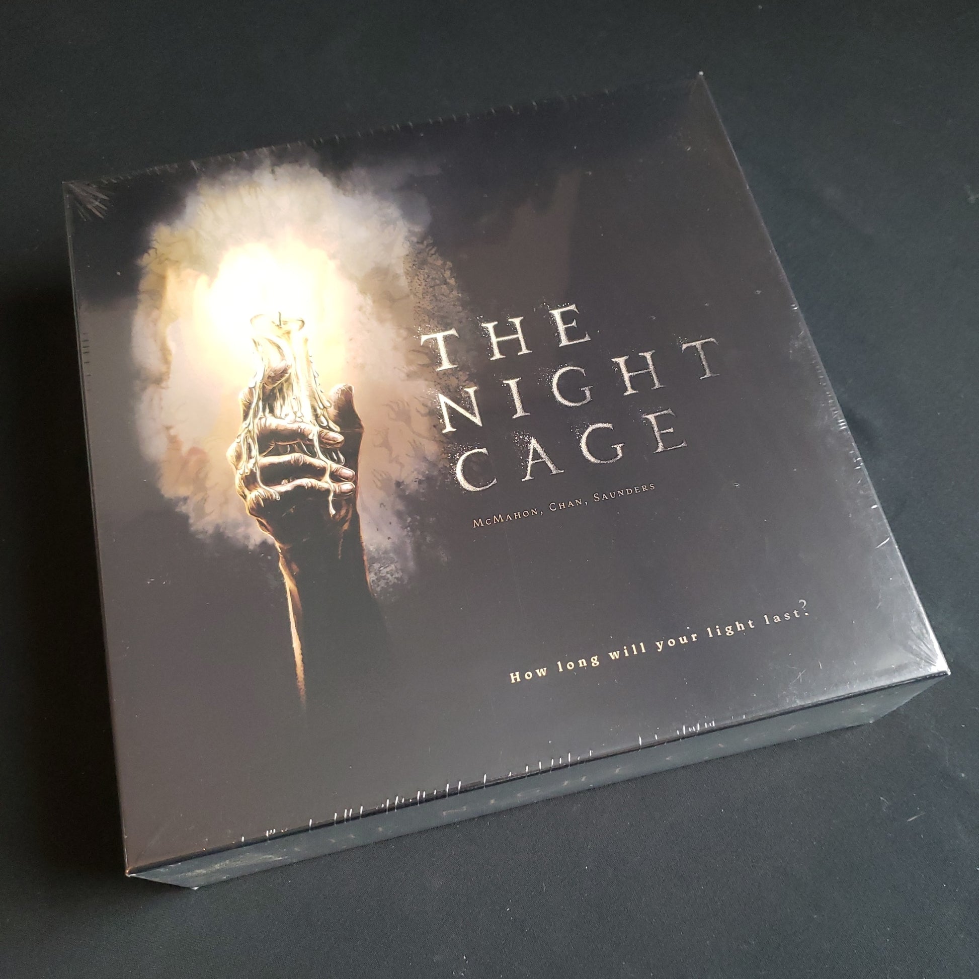 Image shows the front cover of the box of the Night Cage board game