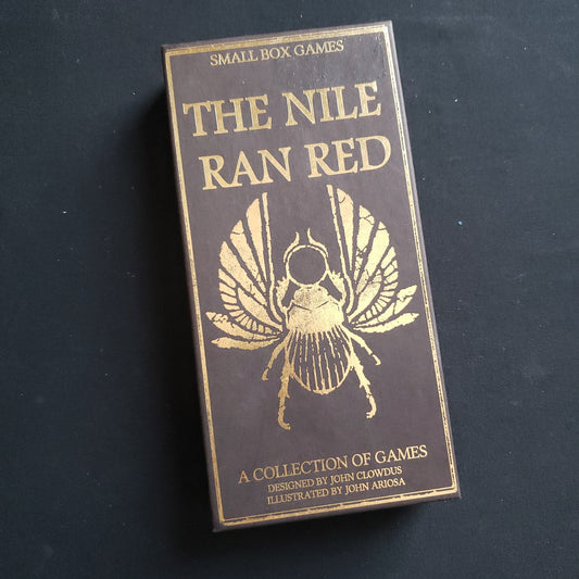 Image shows the front cover of the box of the Nile Ran Red set of card games