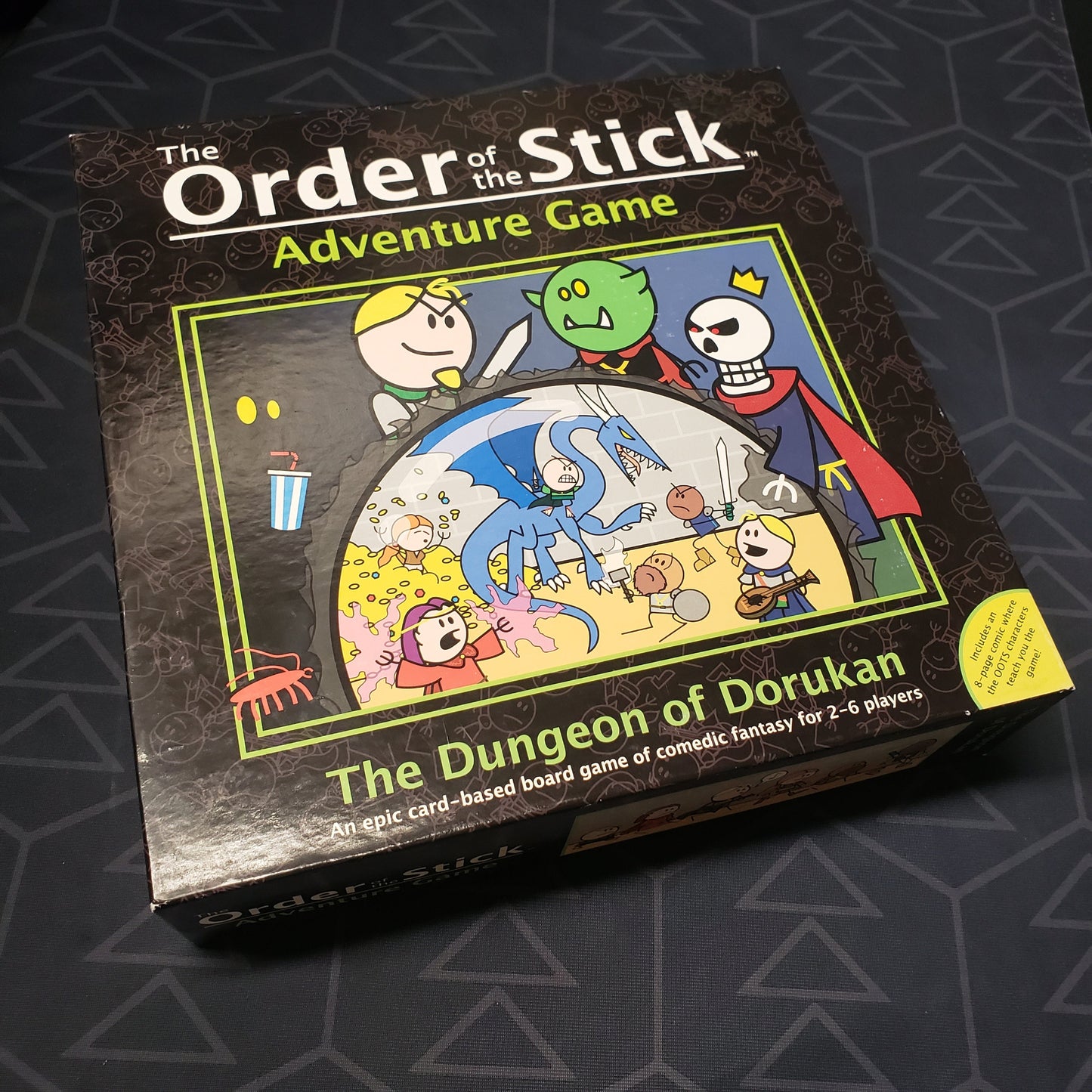 Image shows the front cover of the box for the Order of the Stick Adventure Game: The Dungeon of Dorukan card game