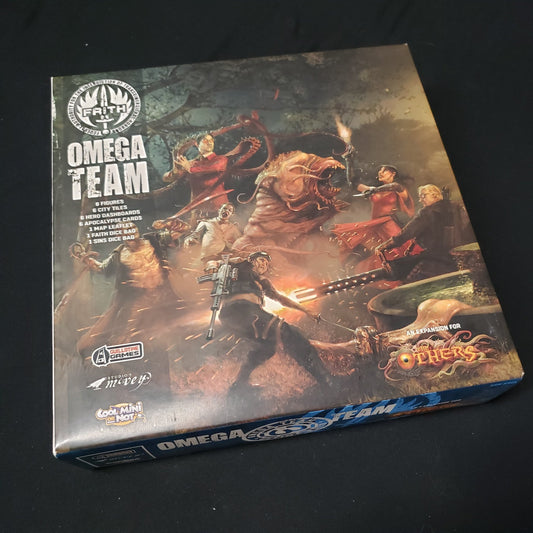 Image shows the front cover of the box of the Omega Team expansion for the board game The Others