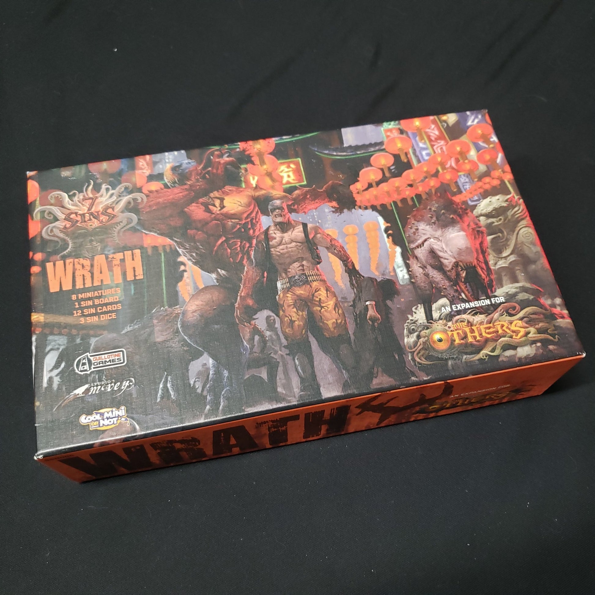 Image shows the front cover of the box of the Wrath expansion for the board game The Others