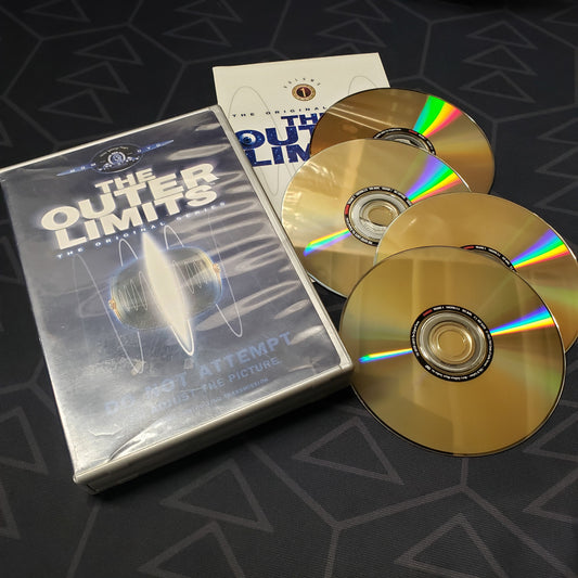 Image shows the case, booklet & four discs for the first season of The Outer Limits: The Original Series on DVD