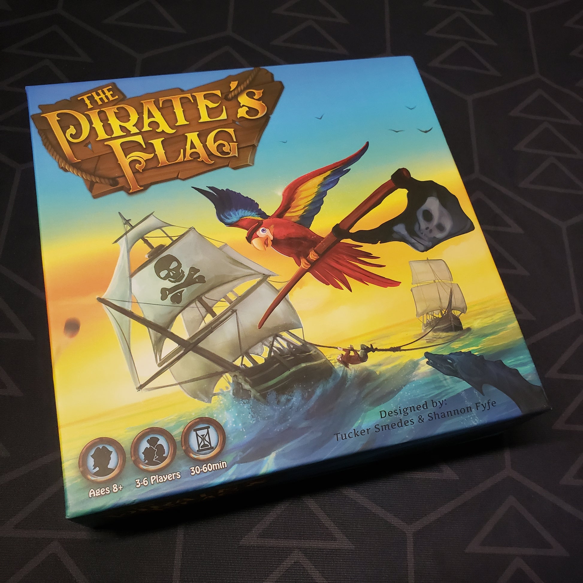Image shows the front cover of the box for the Pirate's Flag board game