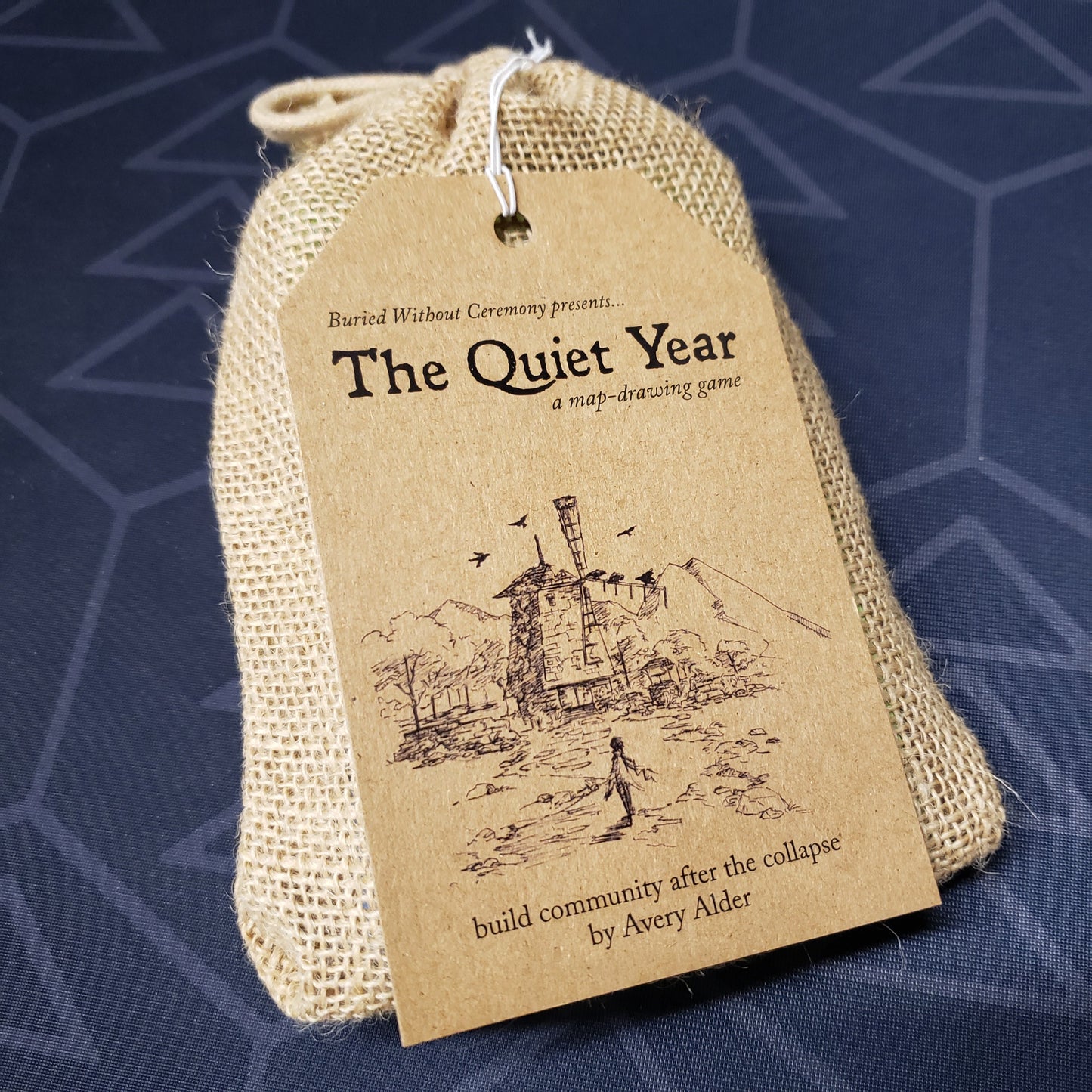 Image shows the front cover of the bag of the roleplaying game The Quiet Year