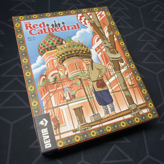 Image shows the front cover of the box for the board game The Red Cathedral
