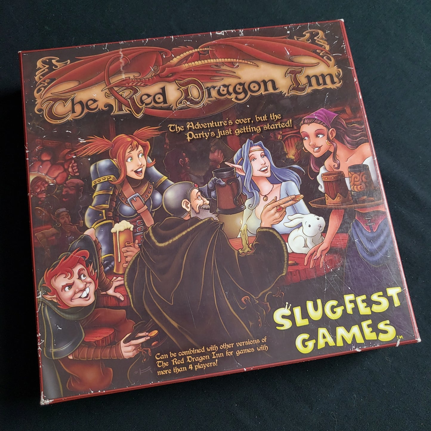 Image shows the front cover of the box of the Red Dragon Inn card game