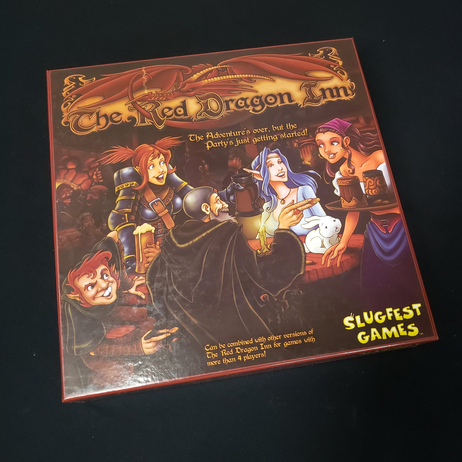 Image shows the front cover of the box of the Red Dragon Inn card game