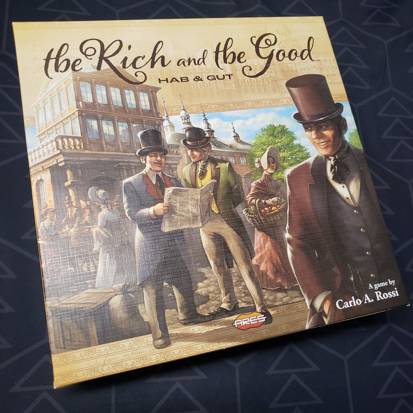 Image shows the front cover of the box for the The Rich and the Good (Hab & Gut) board game