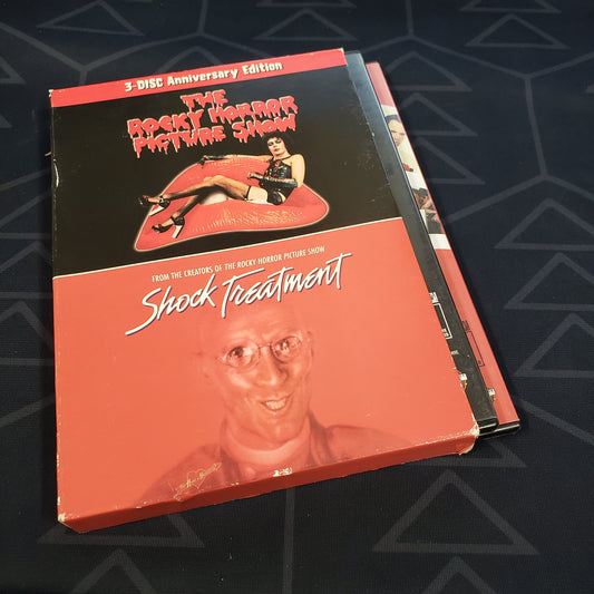 Image shows the outer box with cases sticking out for the 3-Disc Anniversary set of the movies The Rocky Horror Picture Show & Shock Treatment on DVD