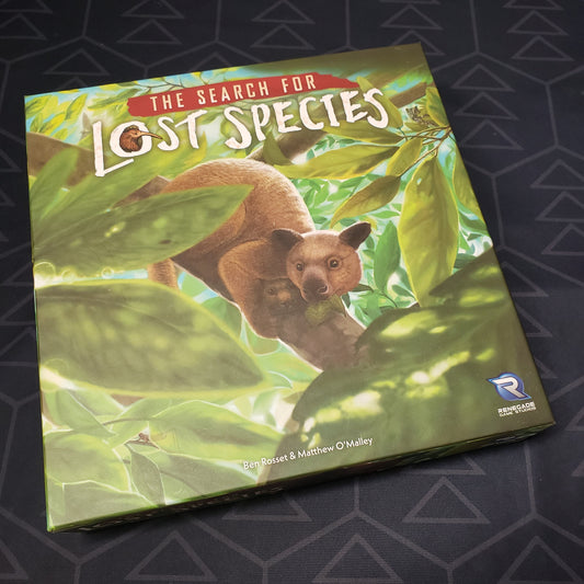 Image shows the front cover of the box for the Search for Lost Species board game