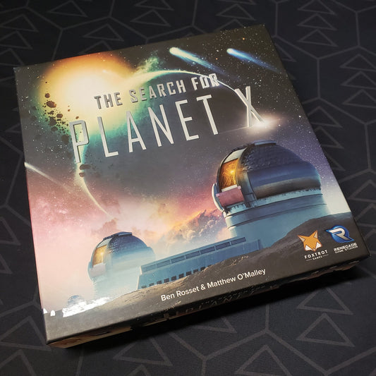 Image shows the front cover of the box of the Search for Planet X board game