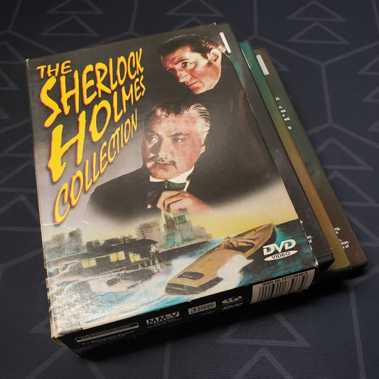 Image shows the outer box with three fanned out disc cases for the Sherlock Holmes Collection on DVD
