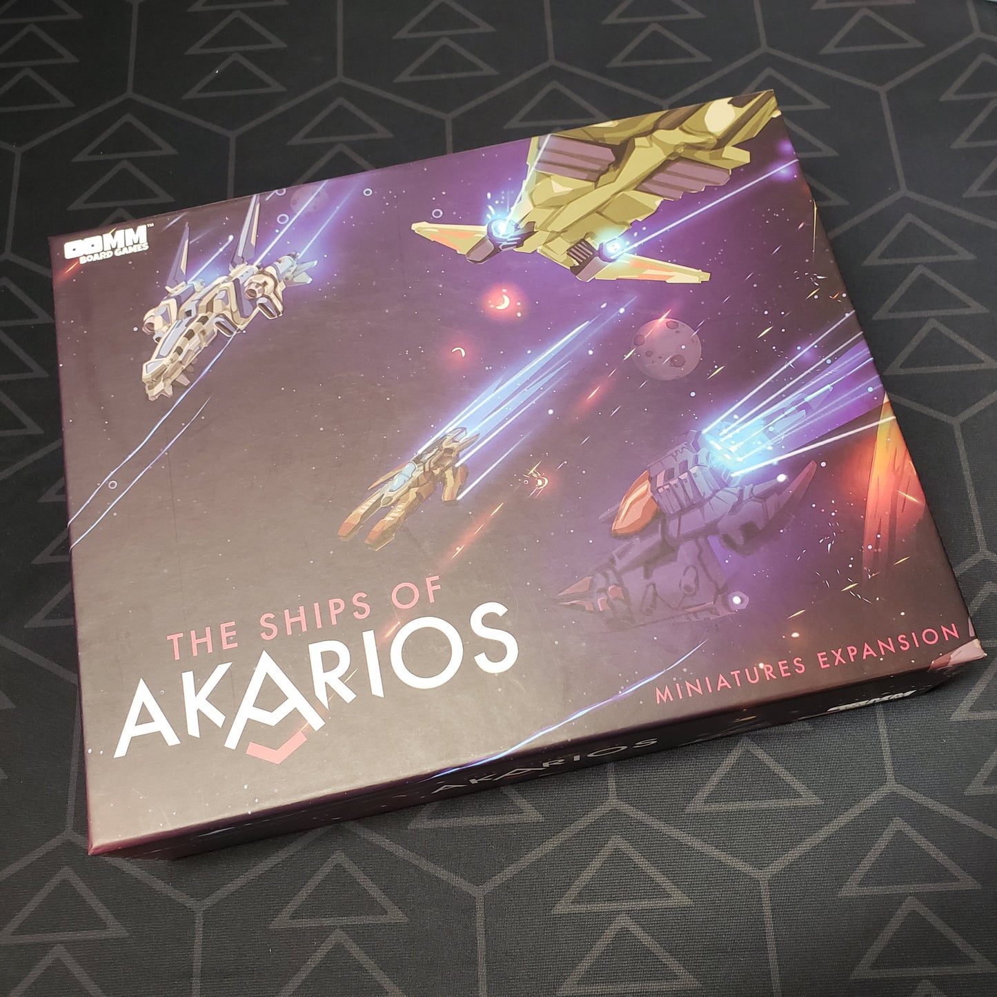 Image shows the front of the box for the Ships of Akarios miniatures expansion for the board game Stars of Akarios