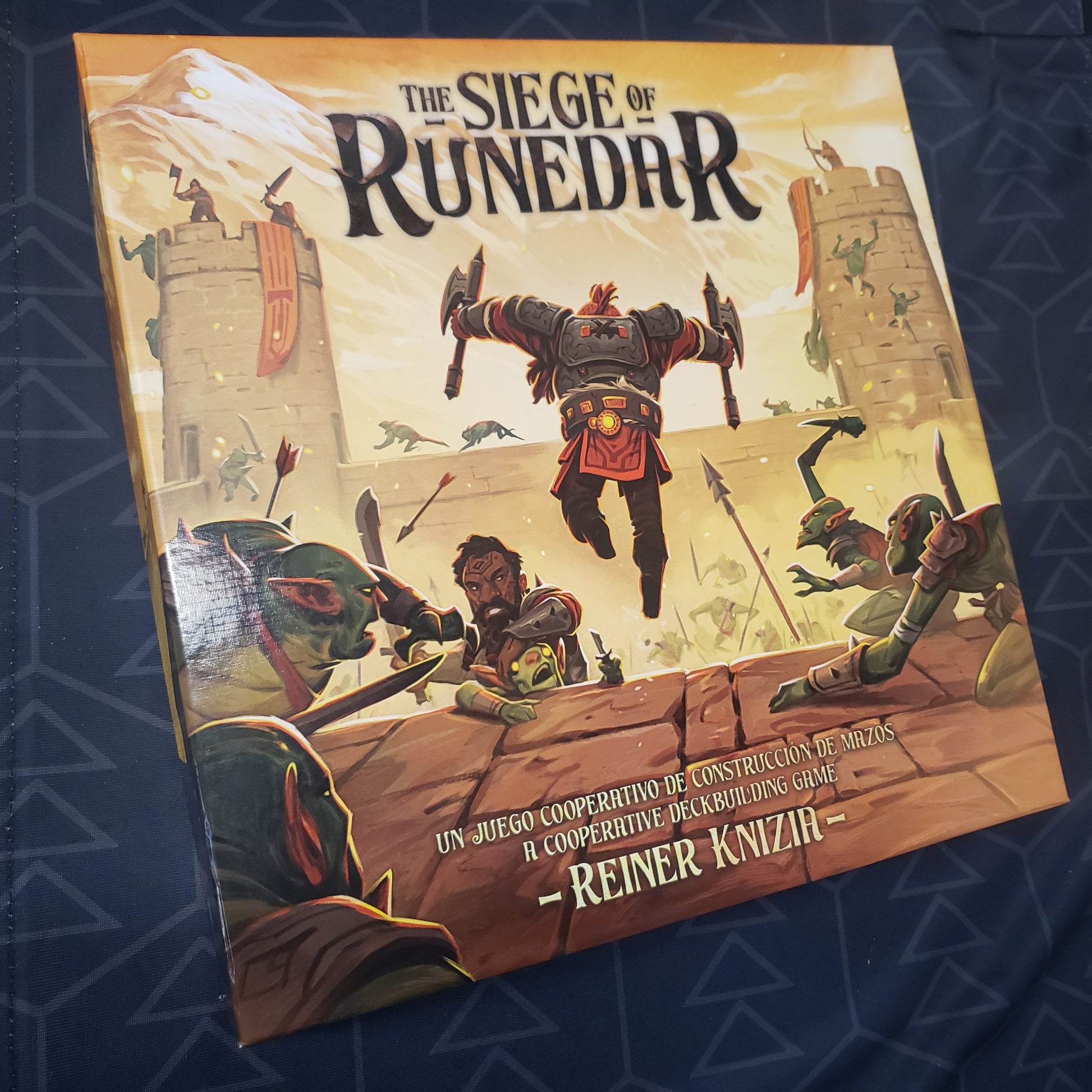 Image shows the front cover of the box for the Siege of Runedar board game