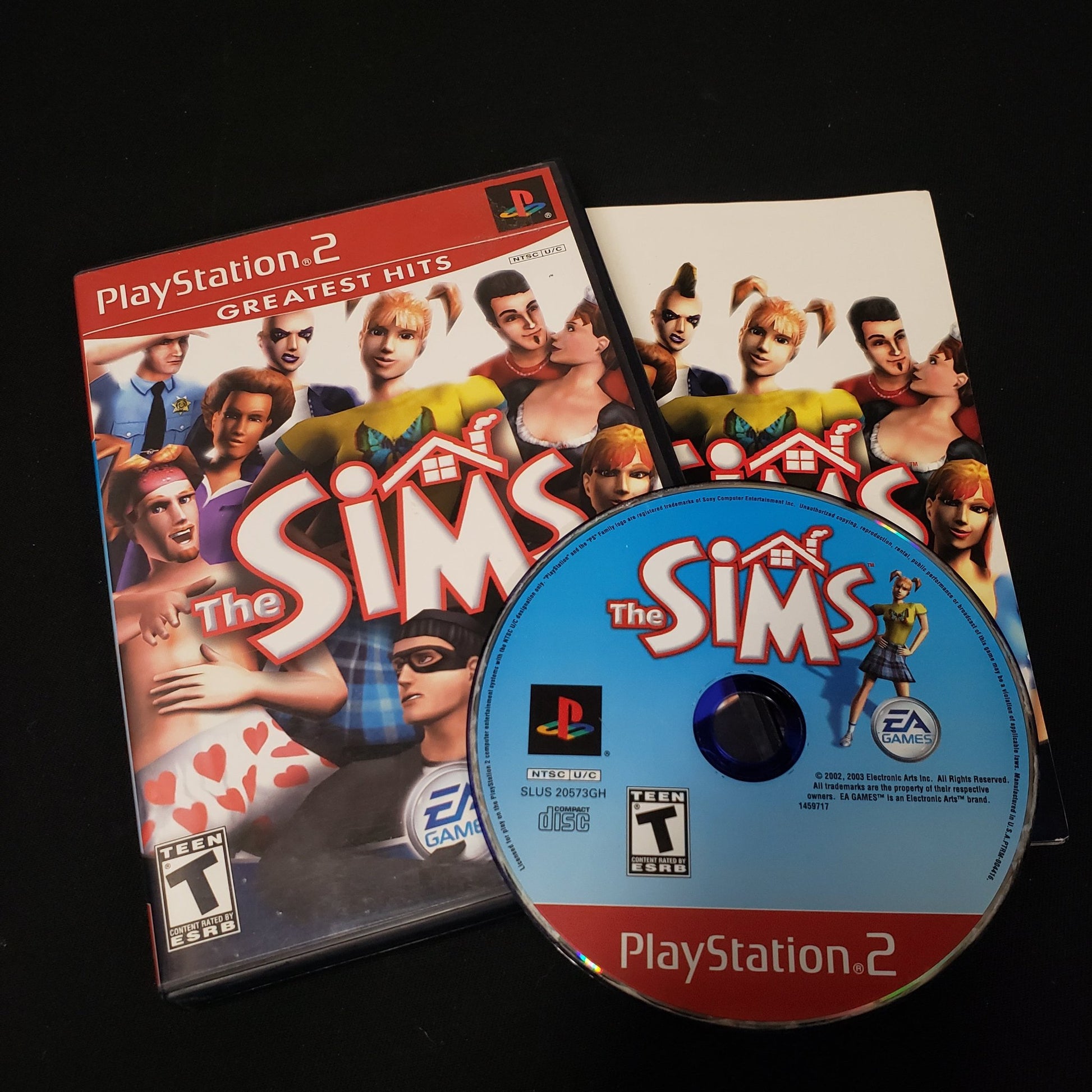 Image shows the case, manual & disc for the video game The Sims for Playstation 2