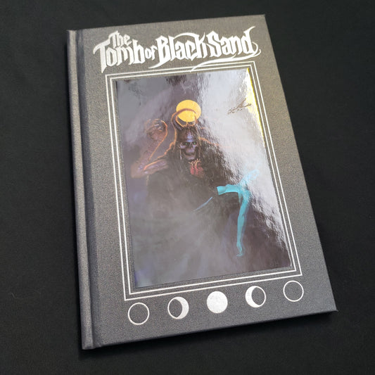 Image shows the front cover of the Tomb of Black Sand roleplaying game book