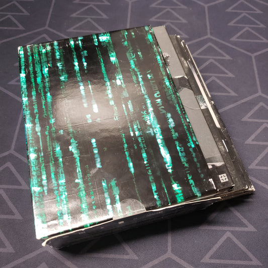 Image shows the outer box with fanned-out cases for the Ultimate Matrix Collection movie set on DVD