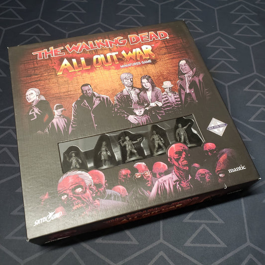 Image shows the front cover of the box for the The Walking Dead: All-Out War Miniatures board game