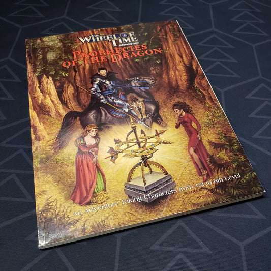 Image shows the front cover of the Prophecies of the Dragon book for the roleplaying game The Wheel of Time