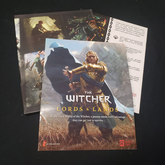 Image shows the front cover of the package, GM screen and booklet for the Lords & Lands pack for the roleplaying game the Witcher