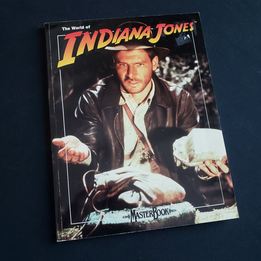 Image shows the front cover of the core rulebook for the World of Indiana Jones roleplaying game