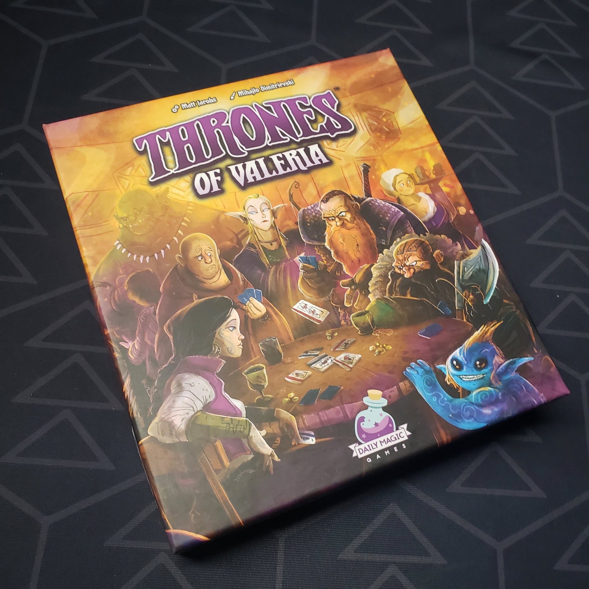 Image shows the front cover of the box for the Thrones of Valeria card game