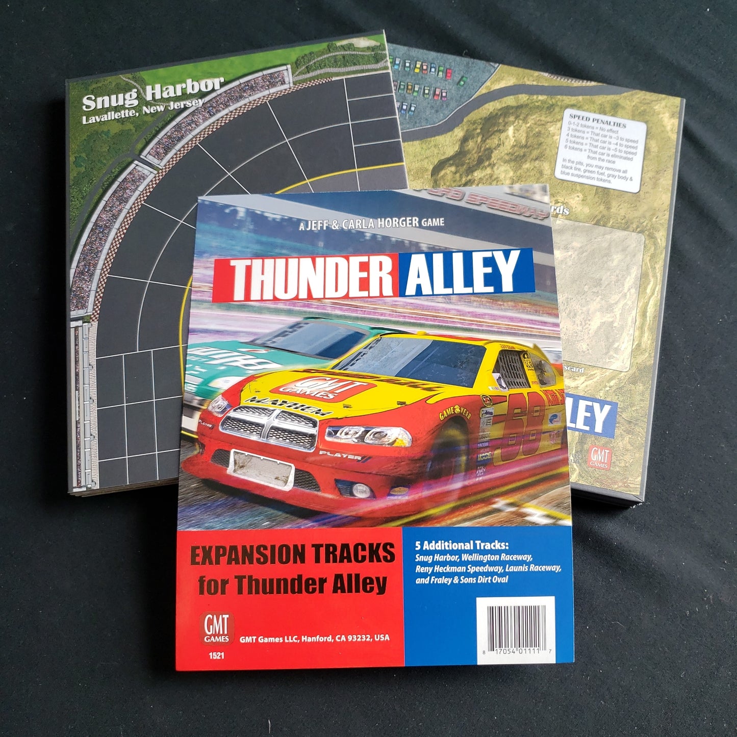 Image shows the 2 boards and info page from the Expansion Tracks pack for the Thunder Alley board game