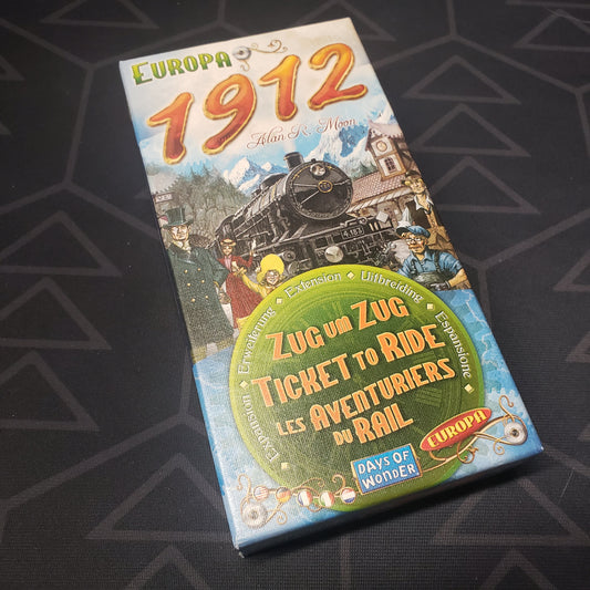 Image shows the front cover of the box of the Europa 1912 expansion for the board game Ticket to Ride: Europe