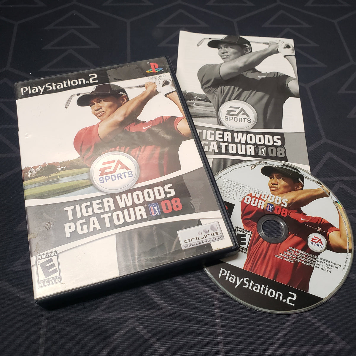 Image shows the case, manual and disc for the video game Tiger Woods PGA Tour 08 for Playstation 2