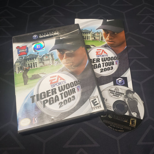 Image shows the case, manual and disc for the video game Tiger Woods PGA Tour 2003 for Nintendo GameCube