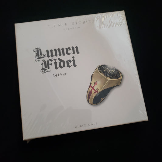 Image shows the front cover of the box of the Lumen Fidei expansion for the board game TIME Stories