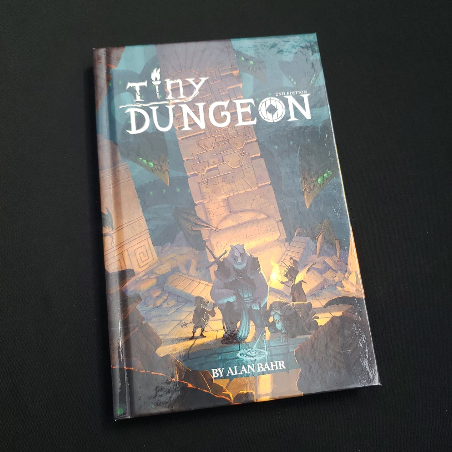 Image shows the front cover of the Tiny Dungeon 2E roleplaying game book