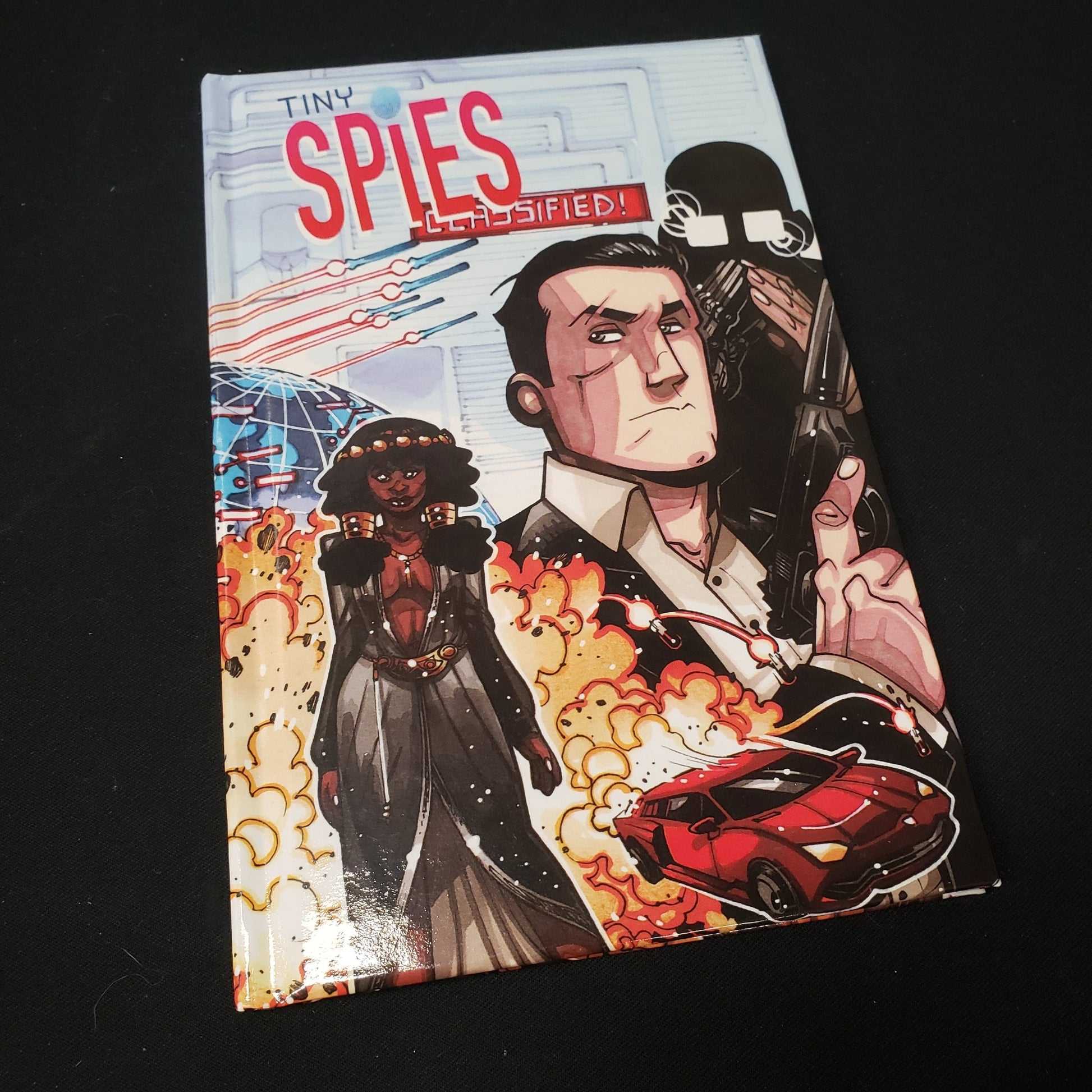 Image shows the front cover of the Tiny Spies roleplaying game book