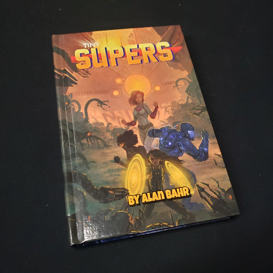Image shows the front cover of the Tiny Supers roleplaying game book