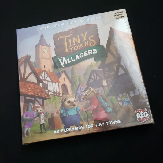 Image shows the front of the box for the Villagers expansion for the Tiny Towns board game