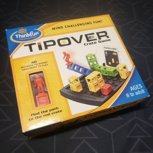 Image shows the front cover of the box for the Tipover Crate puzzle game