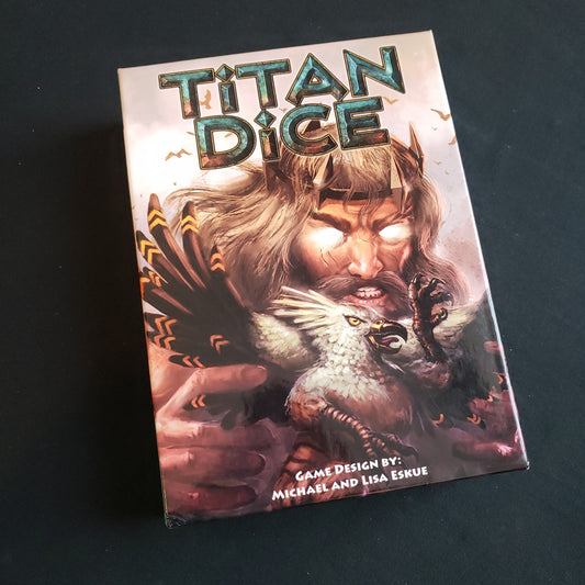 Image shows the front cover of the box of the Titan Dice board game