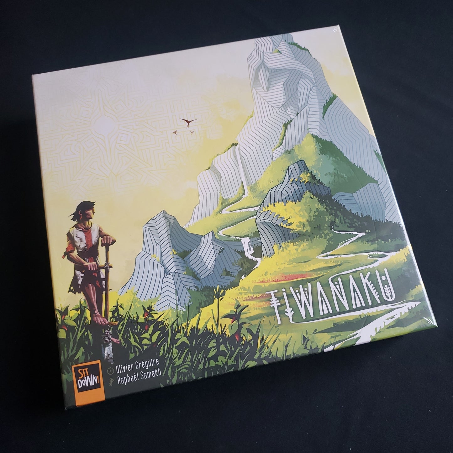Image shows the front cover of the box of the Tiwanaku board game