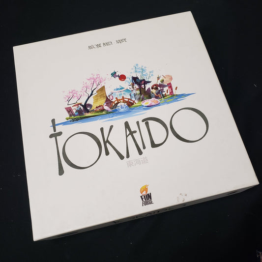 Image shows the front cover of the box of the Tokaido board game