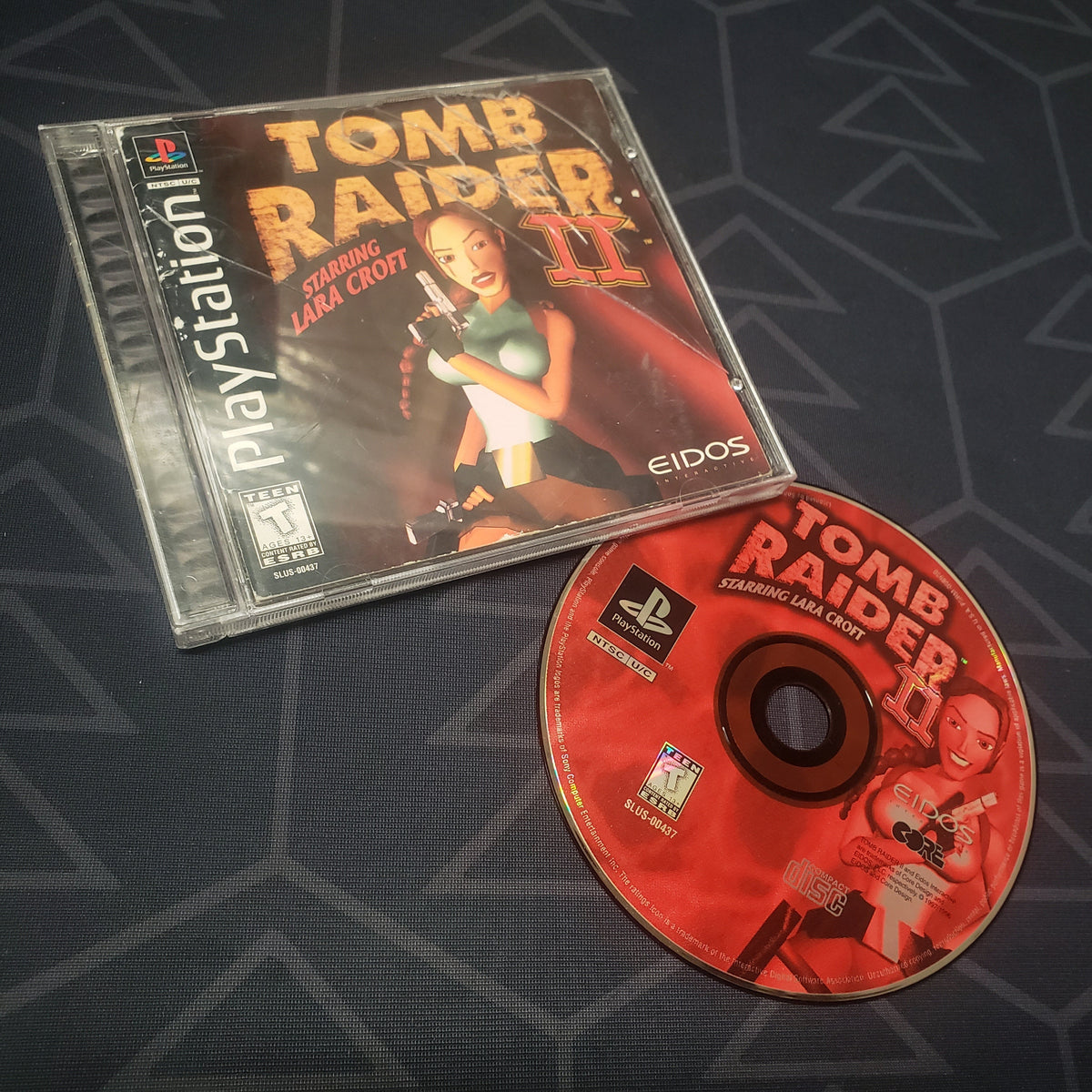 Image shows the jewel case with manual and disc for the video game Tomb Raider II for Playstation 1