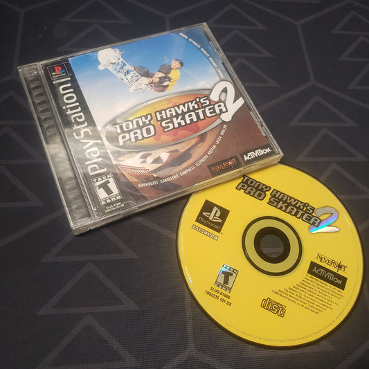 Image shows the jewel case with manual and disc for the video game Tony Hawk's Pro Skater 2 for Playstation 1