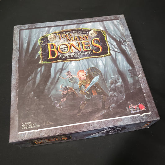 Image shows the front cover of the box of the Too Many Bones board game